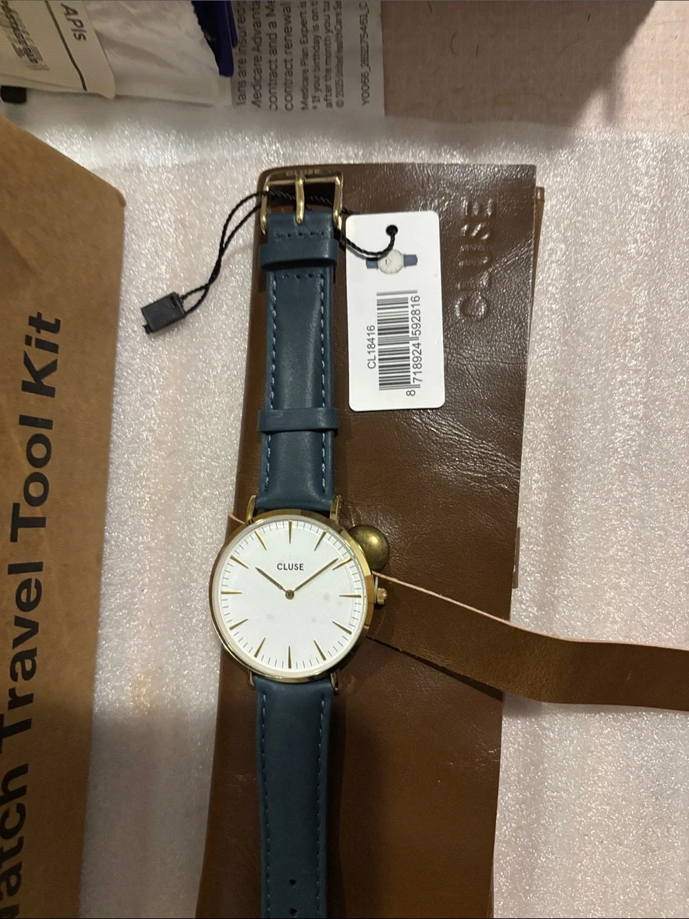 CLUSE Women’s Gold Case Watch with Blue Leather Strap